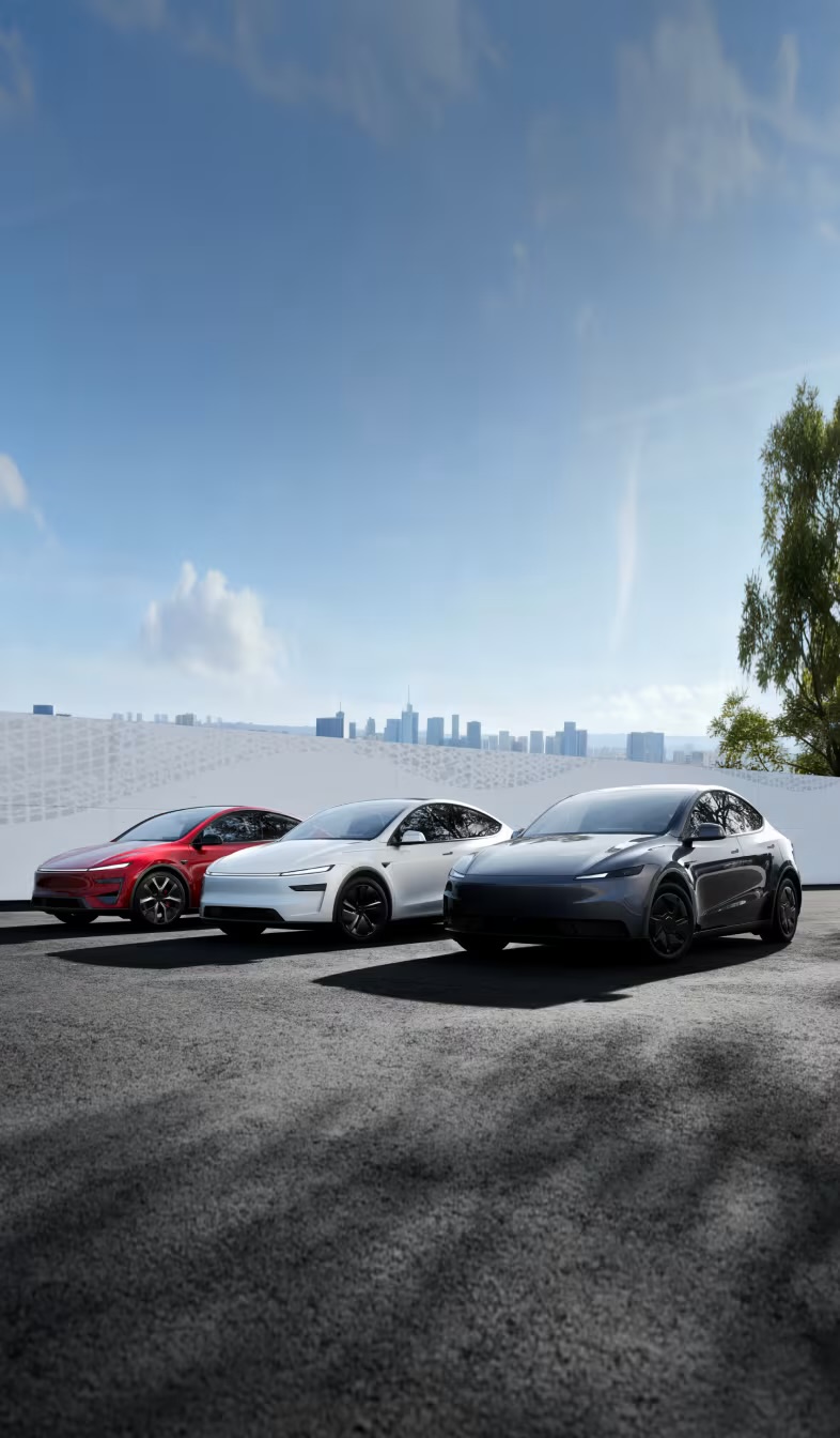 Tesla lineup — Model 3, Model Y and Cybertruck with city skyline
