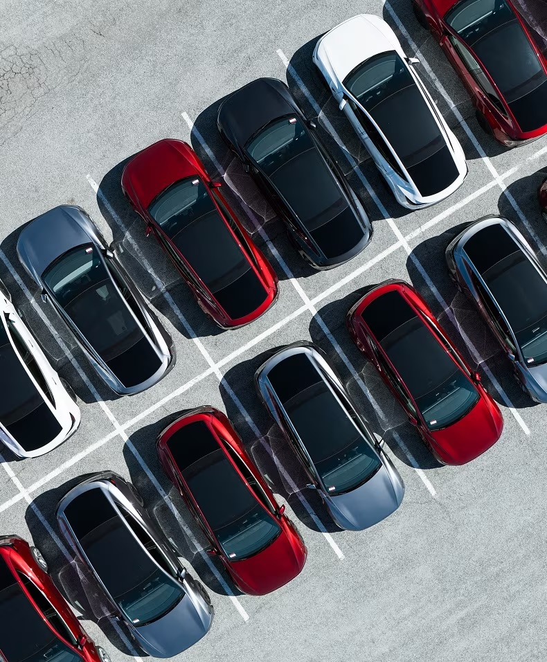 Aerial view of Tesla vehicles in a delivery lot