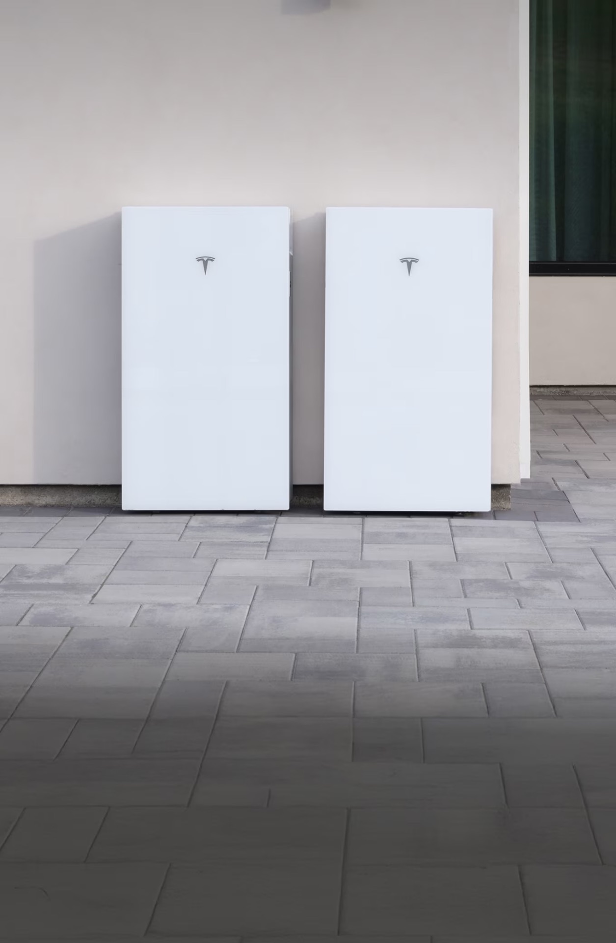 Tesla Powerwall home batteries installed outdoors